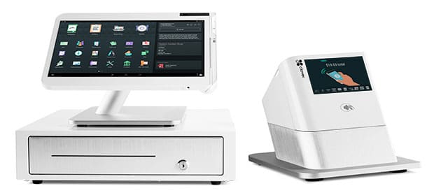 A white cash register and tablet on top of a table.